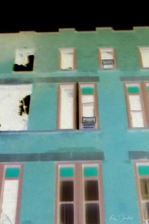 Brick Building with Red and Green Windows's poster
