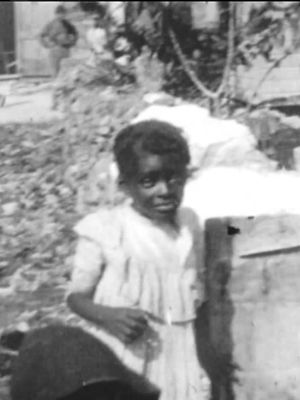 Native Woman Washing a Negro Baby in Nassau, B.I.'s poster image