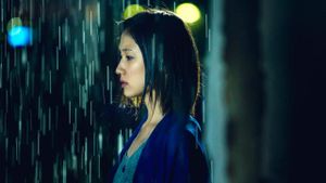 A Woman Wavering in the Rain's poster