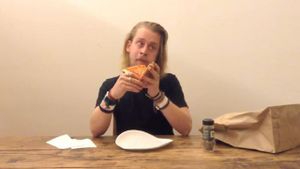 Macaulay Culkin Eating a Slice of Pizza's poster