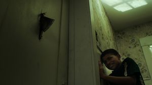 The Boy Behind the Door's poster