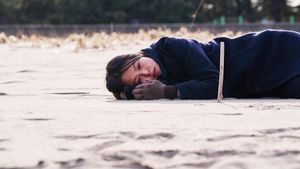 On the Beach at Night Alone's poster