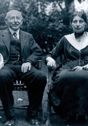 Alfred and Lucie Dreyfus, with Kiss as Deep as My Love's poster