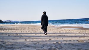 On the Beach at Night Alone's poster