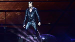 Johnny Hallyday Allume le feu au Stade de France's poster