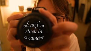 oh no i'm stuck in a camera's poster
