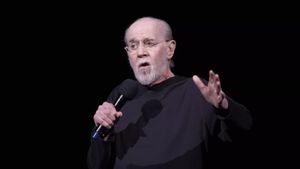 Unmasked with George Carlin's poster