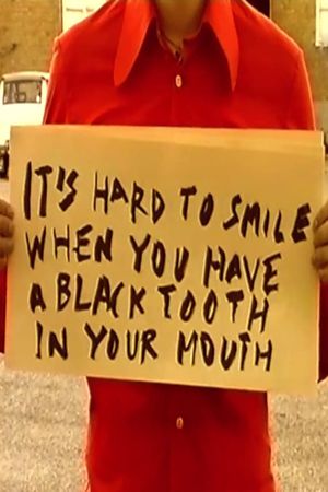 It's Hard to Smile When You Have a Black Tooth in Your Mouth's poster image