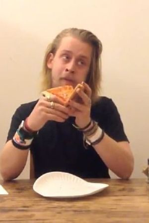 Macaulay Culkin Eating a Slice of Pizza's poster